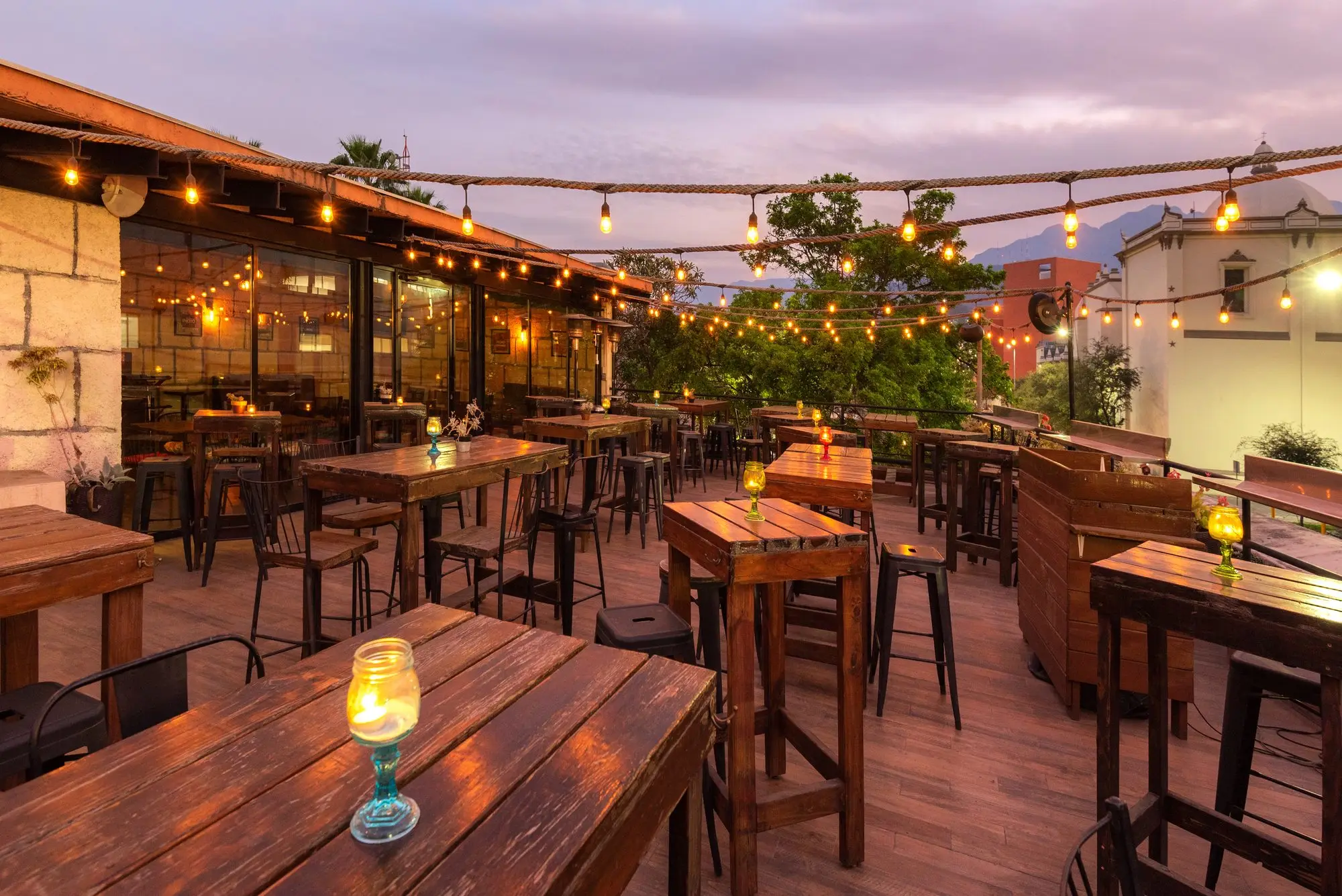 The string lights lit over the tables of Terraza Coss, as evening falls