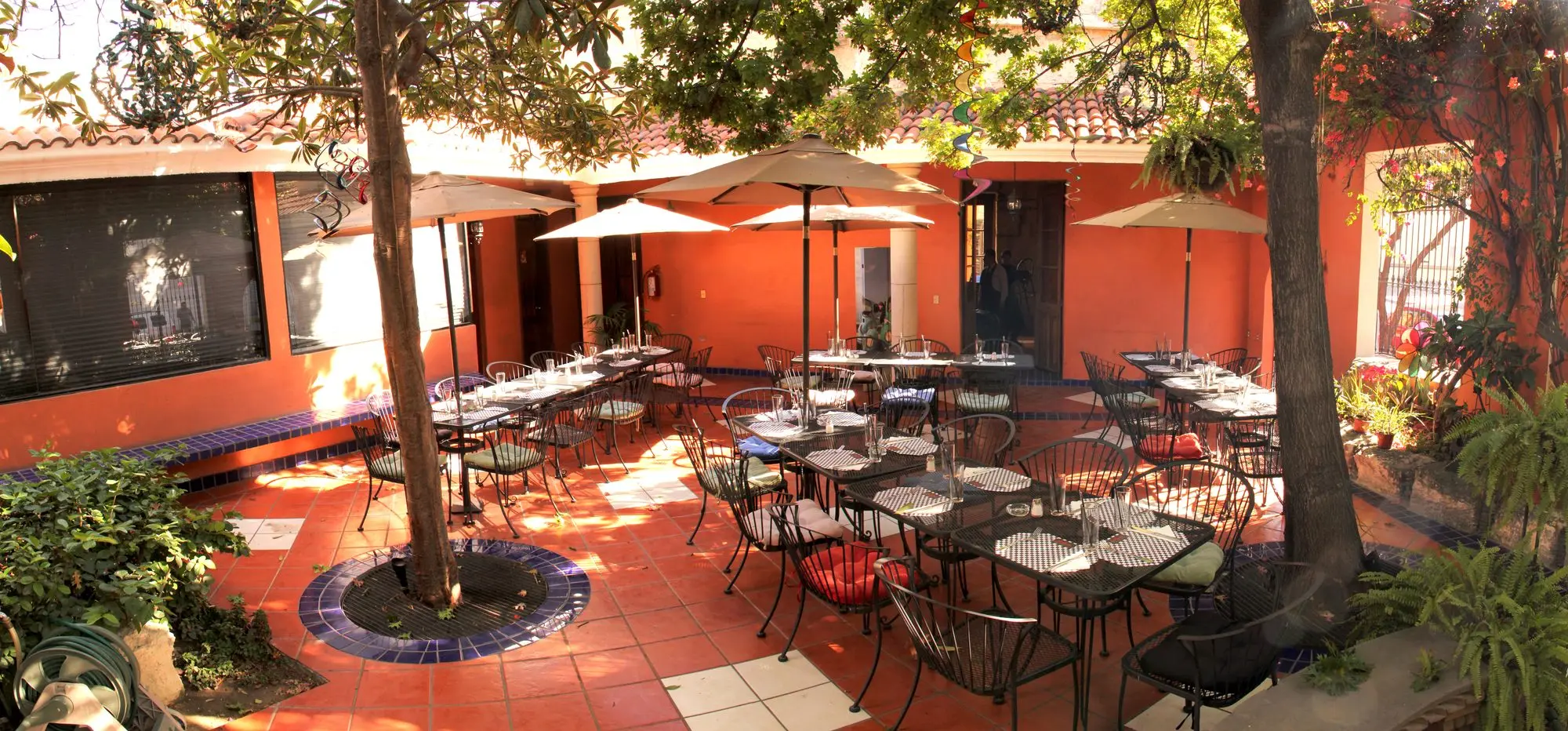The Garden by day, with the parasols open and the tree at the center