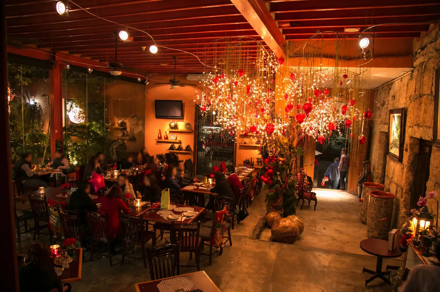 The Main Dining Room mid-service at night, with the decorations and the lights hanging over the tables